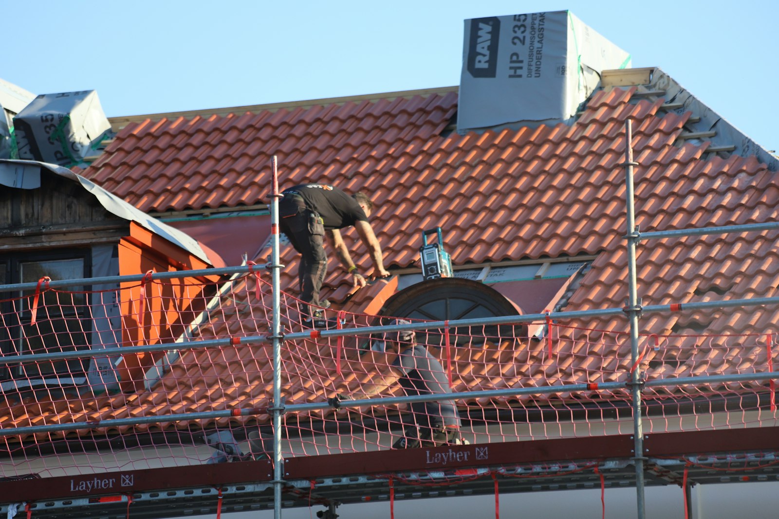 Roofer working on a commercial roof installation